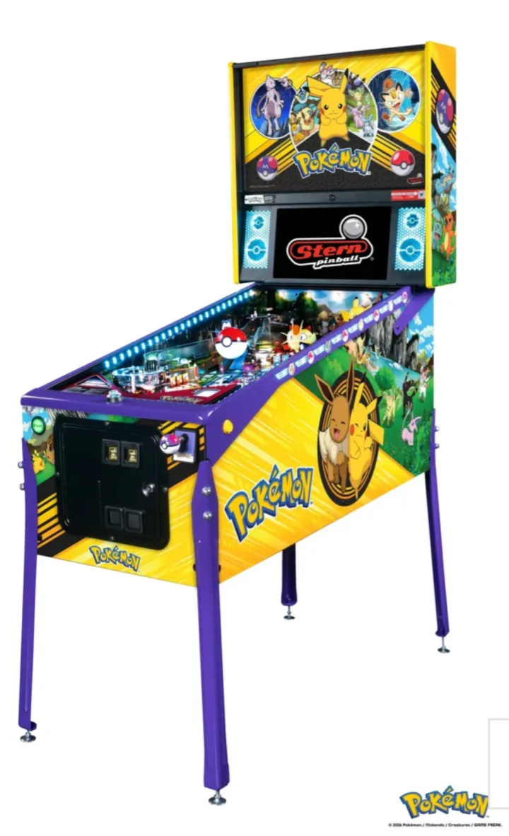 Stern Pokémon pinball machine, three-quarter view from the front right, showing the yellow cabinet side art and the backglass.